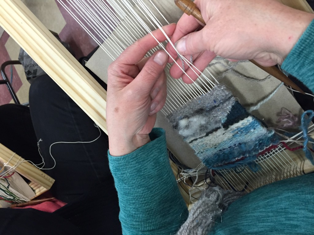 Close up on hands tapestry weaving