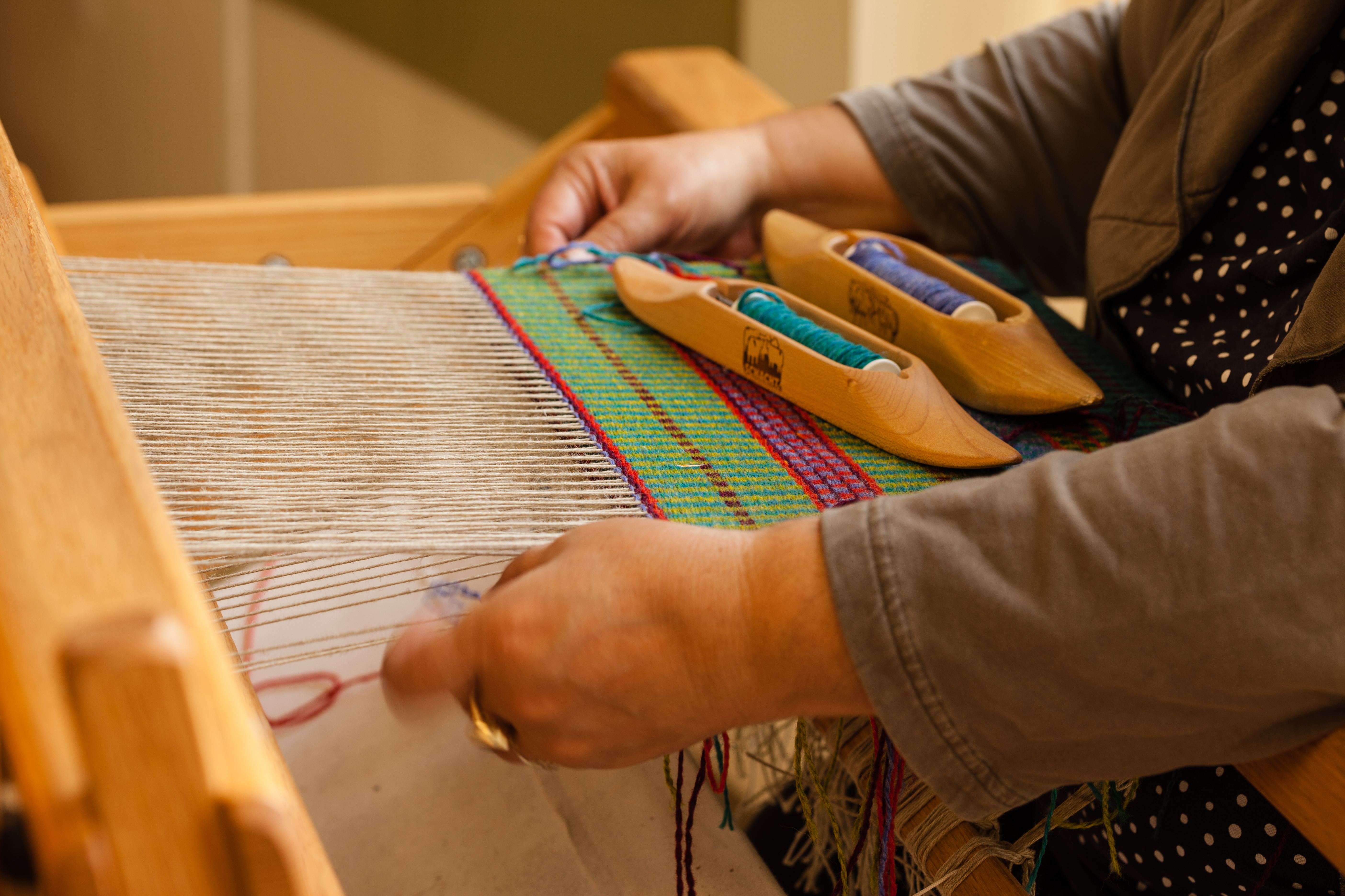 weaving at a loom