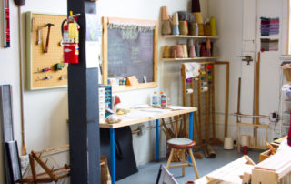 portrait of desk with tools, stool, fire extinguisher