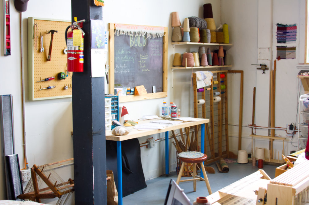 portrait of desk with tools, stool, fire extinguisher 